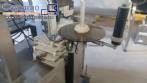 Automatic self-adhesive labeling machine for cylindrical bottles