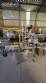 Automatic self-adhesive labeling machine for cylindrical bottles