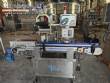 Automatic self-adhesive labeling machine for cylindrical bottles