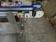 Automatic self-adhesive labeling machine for cylindrical bottles