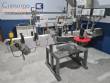 Automatic labeling machine for bottles, jars, and containers, for self-adhesive labels.