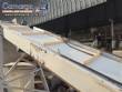 Inclined conveyor belt with talisca