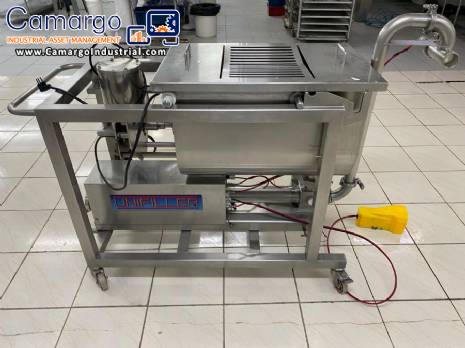 Unifiller stainless steel dosing pump with homogenizing mixer for bakery foods.