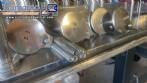 Gravimetric rotary filling machine in stainless steel with cabin