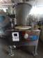 Erli rotary liquid filling machine with 4 pistons, 14,400 units per hour.