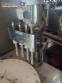Erli rotary liquid filling machine with 4 pistons, 14,400 units per hour.