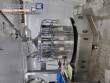 Filling line for 10 and 20 liter gallon jugs with filling machine and rinser/washer.