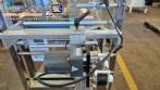 Dosing and packaging machine for granular and powdered products