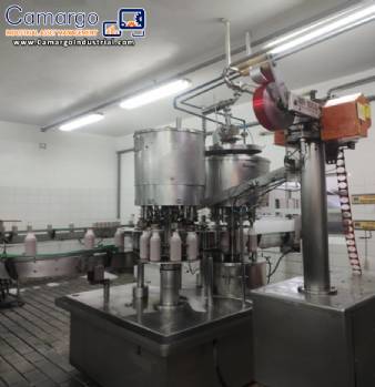 Stainless steel rotary filling machine with 8 nozzles, Serac brand, for liquids, fluids, beverages, juices, dairy drinks, and water.
