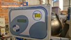 Automatic double-head labeling machine for cylindrical and flat bottles, Tudela, 3,000 labels per hour.