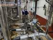 Stainless steel processing reactor tanks, 1140 liters, with pump valves.