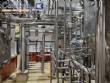 Stainless steel processing reactor tanks, 1140 liters, with pump valves.