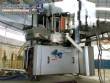 Krones automatic rotary label applicator for paper labels.