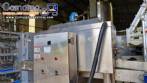 Labeling machine with steam sleeve tunnel and bottle baler