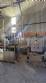 Labeling machine with steam sleeve tunnel and bottle baler