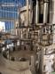 Zegla rotary filling machine with rinser and three-block capping system.
