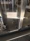 Zegla rotary filling machine with rinser and three-block capping system.