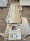 Vibrating trough for multi-head scale