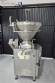 Handtmann vacuum stuffer with twister and tilting elevator, up to 6,000 kg per hour.